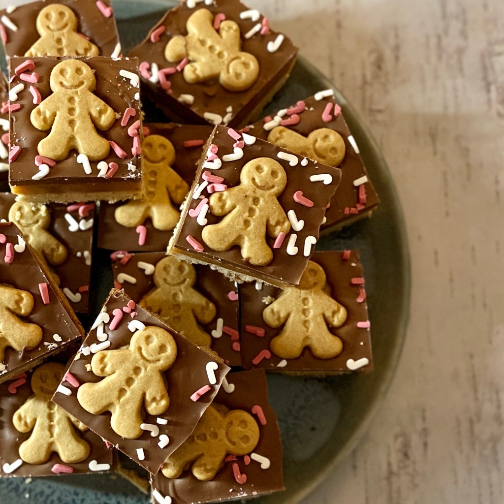 Gingerbread men on a layer of spiced shortbread and a ginger caramel. Topped with a ginger chocolate.